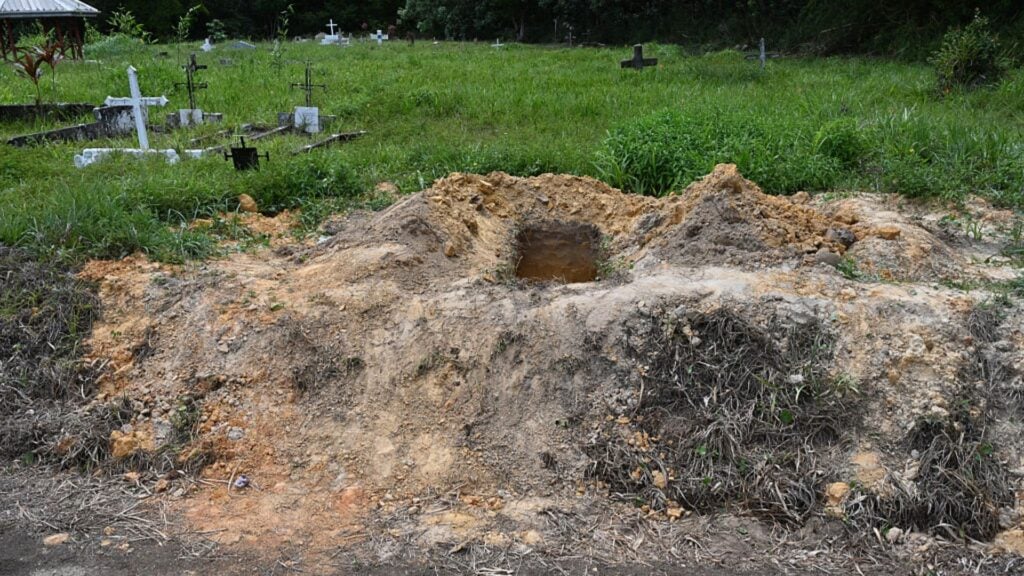 Curtis Chase / AFP/ Getty ImagesA view of an open grave at the cemetery of Cumuto, Trinidad and Tobago, taken on April 18, 2026. The remains of at least 50 infants and six adults were discovered on April 18, 2026, after they had apparently been discarded at a cemetery in Trinidad and Tobago, police said. (Photo by Curtis Chase / AFP)